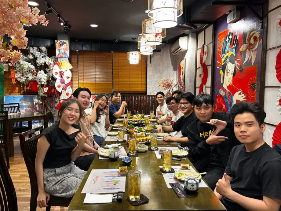 The team gathered around a long table at a Japanese restaurant