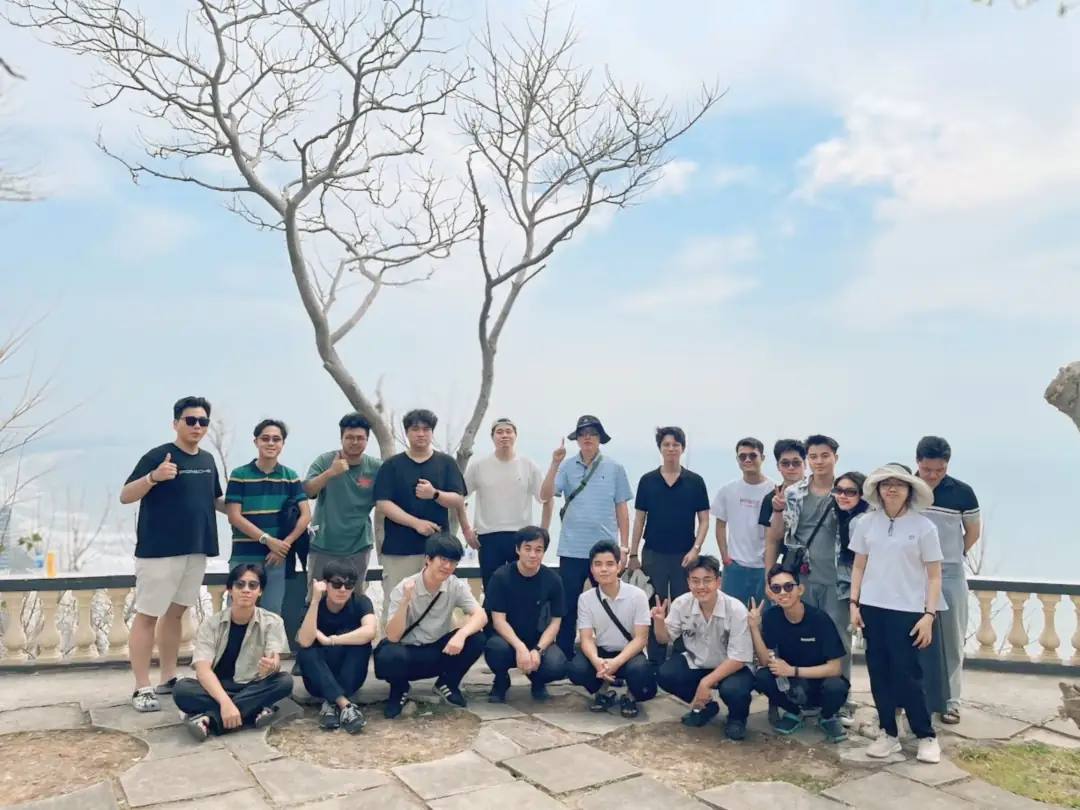 Team photo during a team building trip by the sea